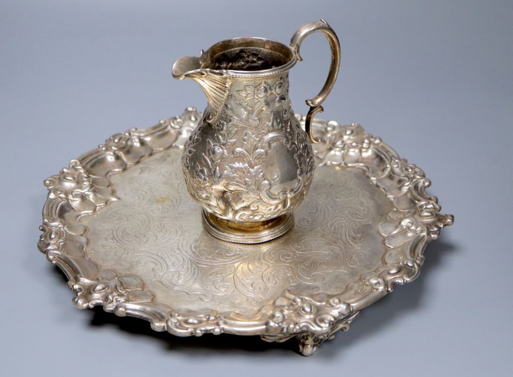 A Victorian embossed silver milk jug, Sheffield, 1860 and a silver salver, London, 1857, 27.5cm, 26oz.